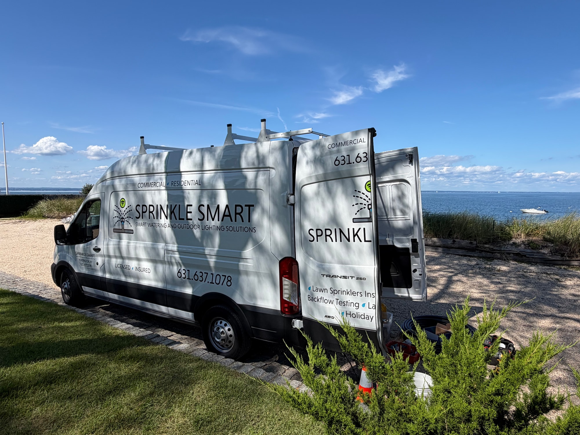 Sprinkle Smart service van parked beside the waterfront
